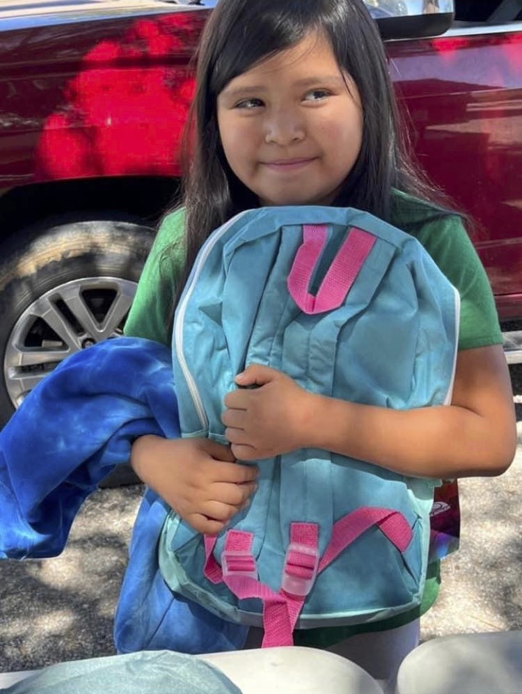 Back to school program for Indigenous Peoples Charity Girl with backpack